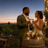 Couple toasting at vineyard wedding outdoors