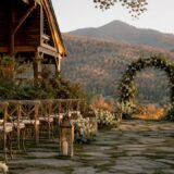 Rustic mountain wedding ceremony setup at sunset