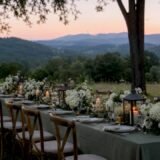 Long wedding table set outdoors at mountain venue