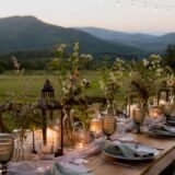 Outdoor mountain wedding reception at sunset