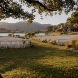 Golden hour light on outdoor wedding lawn