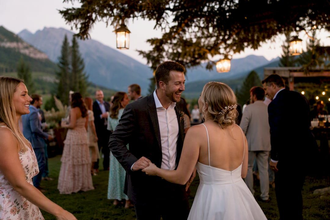 Joyful outdoor wedding celebration at golden hour