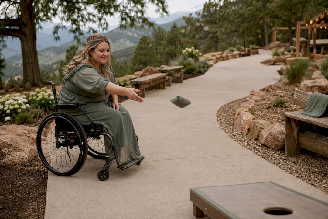 Wheelchair guest using accessible cornhole station