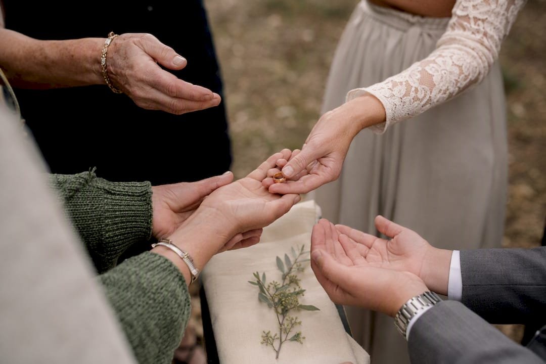 Guests holding rings during warming ritual